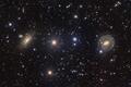 На фотографии из дальнего космоса запечатлены сразу две галактики NGC 5078 и IC879 слева и NGC 5101 справа. Фото: Paul Montague
